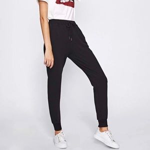 Black drawstring sweatpants.